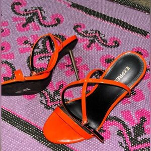 Orange strap gold pumps